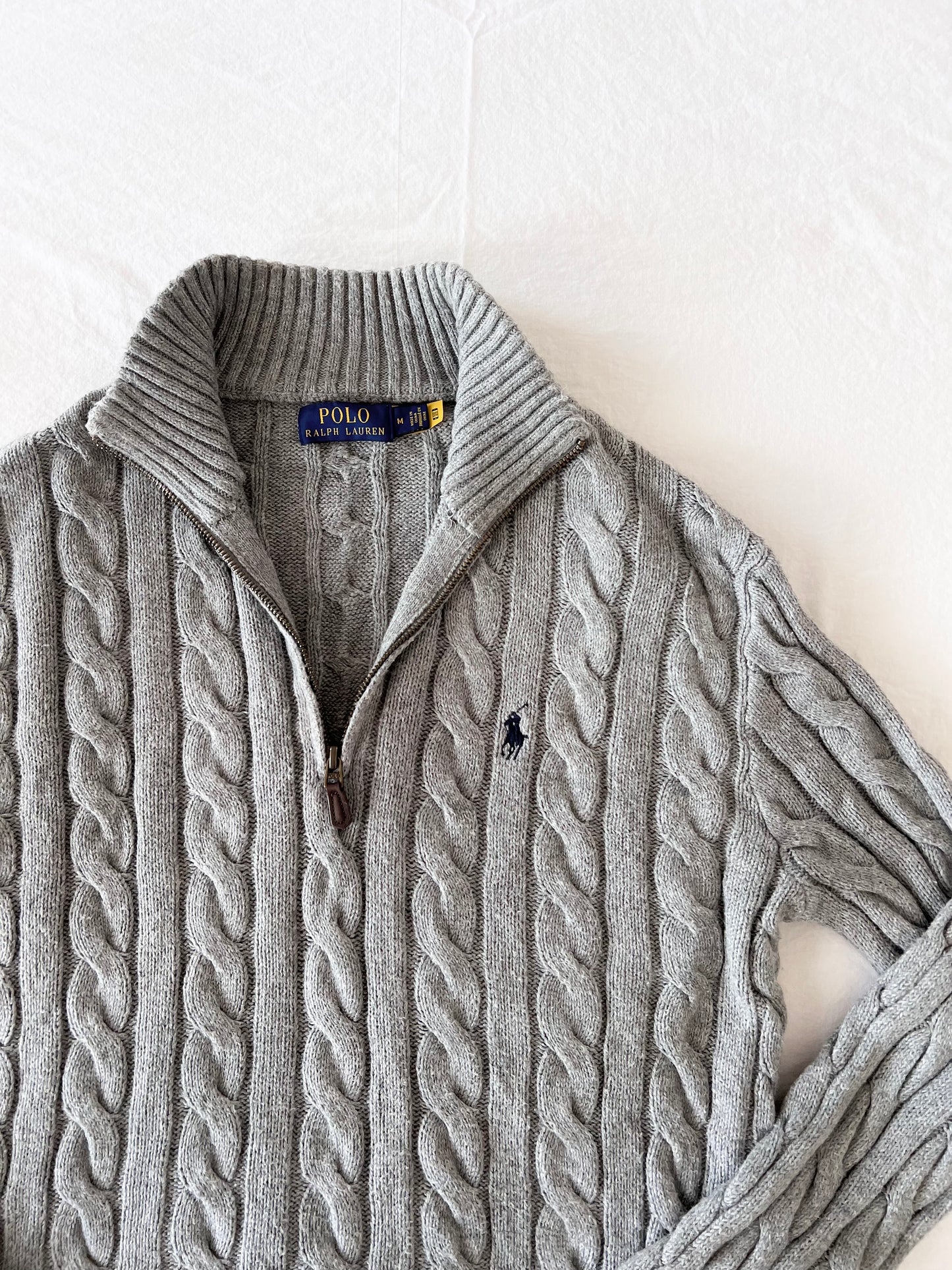Gray half-zip cable knit sweater