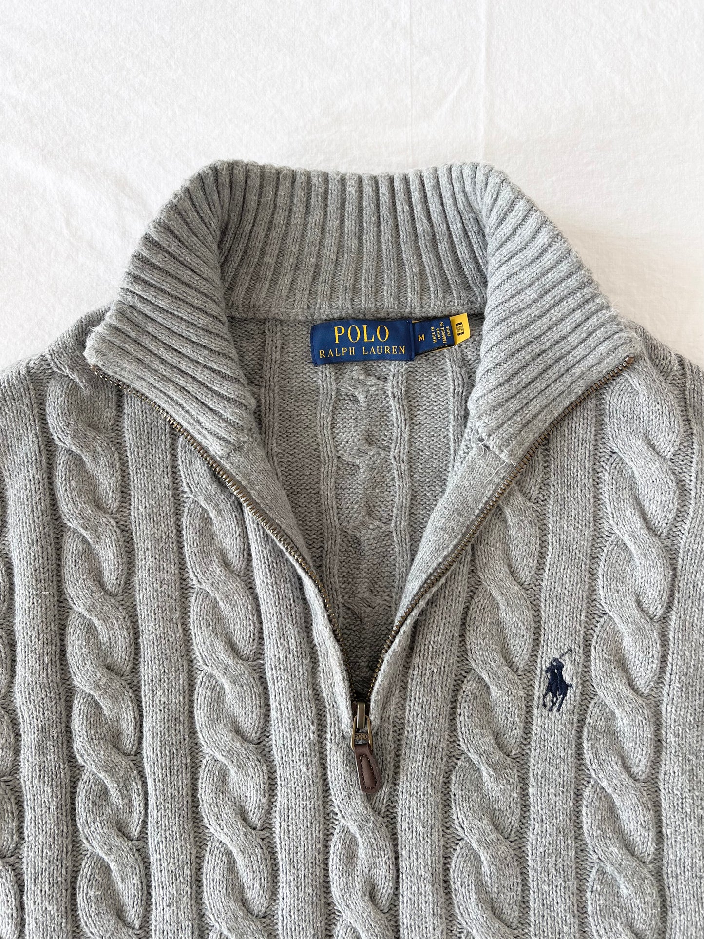 Gray half-zip cable knit sweater